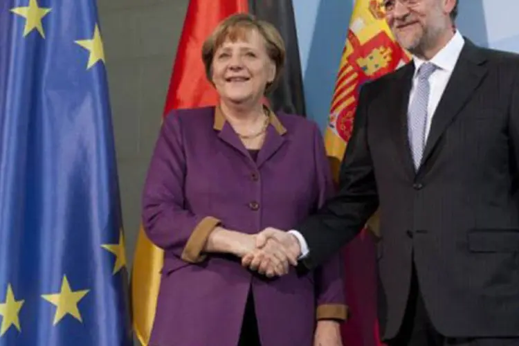 Angela Merkel e Mariano Rajoy: "desejamos ao governo (espanhol) tenha um êxito extraordinário pelos esforços que está promovendo" (John Macdougall/AFP)