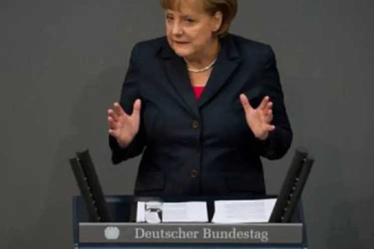 
	Angela Merkel: &quot;Se n&atilde;o conseguimos promover o crescimento econ&ocirc;mico em nossos pa&iacute;ses n&atilde;o poderemos manter este n&iacute;vel de bem-estar t&atilde;o invej&aacute;vel&quot;, disse a chanceler alem&atilde;
 (Johannes Eisele/AFP)