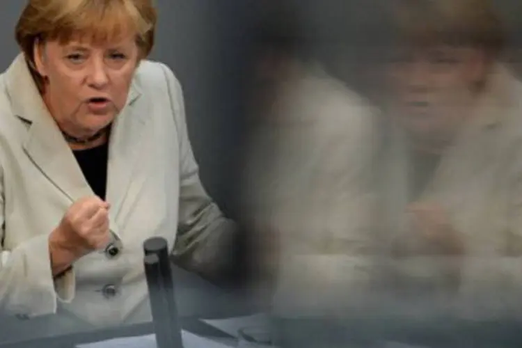 
	A chanceler alem&atilde;, Angela Merkel: &quot;ainda n&atilde;o superamos a crise, mas demos um primeiro passo neste caminho&quot;
 (Johannes Eisele/AFP)