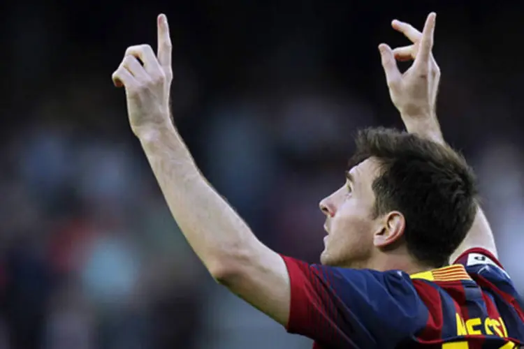 
	Lionel Messi comemora um dos gols marcados na partida contra Osasuna, que o coroou como o maior artilheiro do Barcelona, com 371 gols
 (REUTERS/Albert Gea)