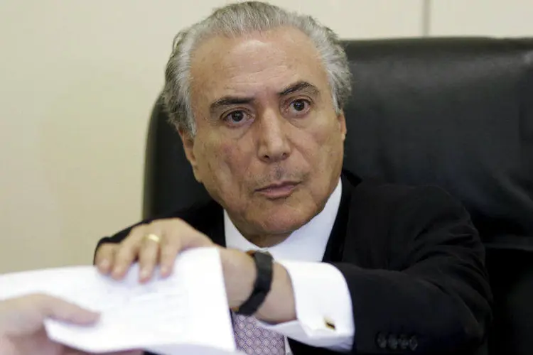 
	Conversa com o PC do B: Temer deu sinais de que se manteria afastado do esfor&ccedil;o do governo para livrar a presidente Dilma Rousseff de um processo de impeachment
 (Ueslei Marcelino/Reuters)