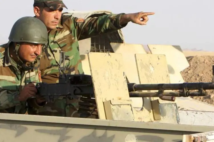 
	Militares curdos durante miss&atilde;o contra jihadistas do Estado Isl&acirc;mico
 (Azad Lashkari/Reuters)