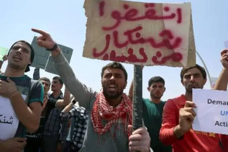 Membros da minoria Yazidi manifestam-se em frente à sede da ONU no Iraque (Safin Hamed/AFP)