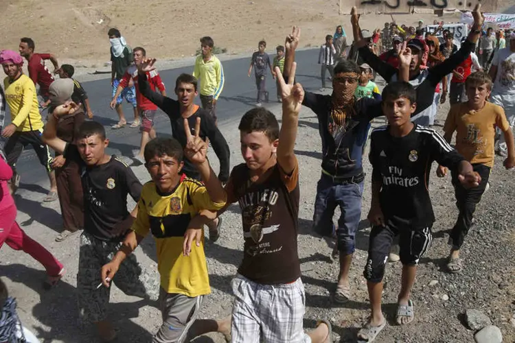
	Desalojados da minoria yazidi: &quot;A crise na S&iacute;ria se tornou a maior emerg&ecirc;ncia humanit&aacute;ria da nossa era&quot;, disse Ant&oacute;nio Guterres, alto comiss&aacute;rio da ONU para Refugiados
 (Youssef Boudlal/Reuters)