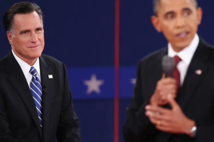 
	Mitt Romney e Barack Obama em segundo debate nos EUA: nos &uacute;ltimos dois dias, Obama vem tentando usar seus eventos de campanha para aproveitar a boa repercuss&atilde;o do debate
 (Getty Images / Scott Olson)