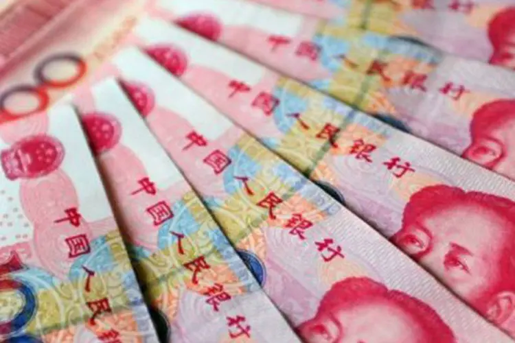 O yuan, a moeda chinesa, ganha peso na cotação de seus pares emergentes | Foto: AFP (Frederic J. Brown/AFP)