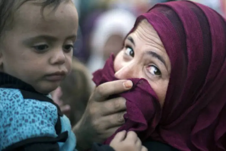 
	Mulher palestina com filho em Gaza: caso de Fahmi &eacute; o segundo do tio registrado na Faixa de Gaza
 (MAHMUD HAMS/AFP/Getty Images)