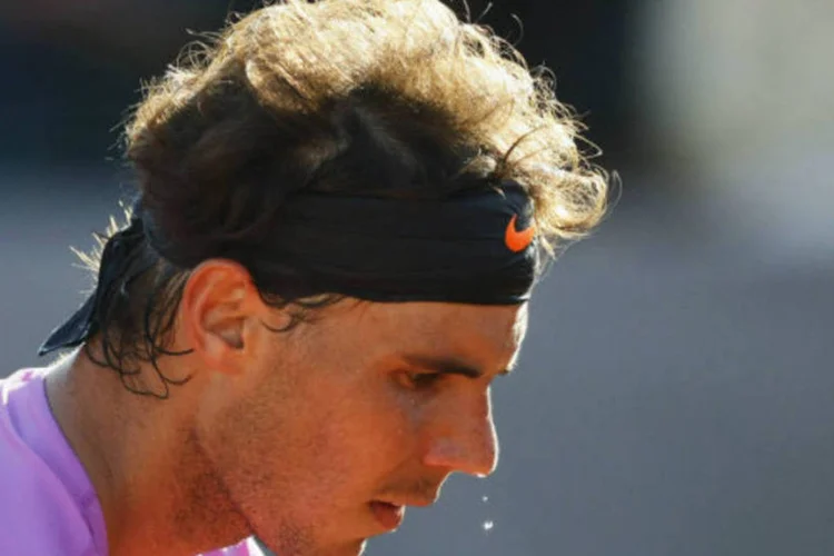 
	Rafael Nadal: ap&oacute;s perder a decis&atilde;o da chave simples do Torneio de Vi&ntilde;a del Mar para o argentino Horacio Zeballos, o n&uacute;mero 5 do mundo voltou a ser derrotado na final de duplas
 (REUTERS/Eliseo Fernandez)