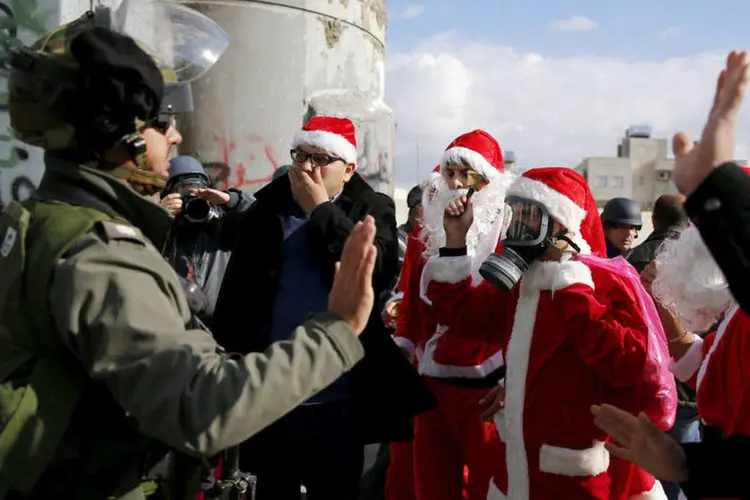 
	Natal: &quot;At&eacute; o ano passado, chegavam de 60 a 70 &ocirc;nibus a cada manh&atilde;&quot;, afirma Hicham Jamis, que trabalha como guia h&aacute; quase uma d&eacute;cada
 (Ammar Awad / Reuters)