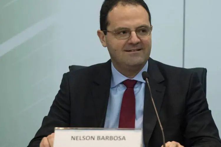 Novo ministro do Planejamento, Nelson Barbosa recebe o cargo de sua antecessora, Miriam Belchior (Marcelo Camargo/Agência Brasil)