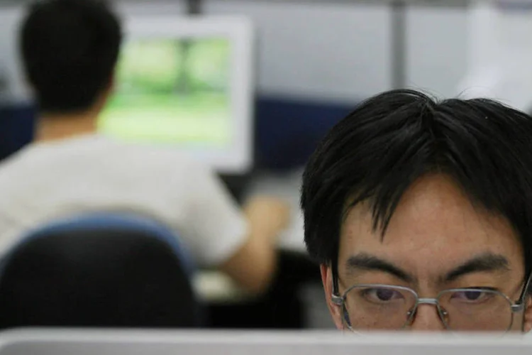 Engenheiros de computação trabalham na sede do Grupo Neusoft, em Shenyang, China (Natalie Behring/Bloomberg News)