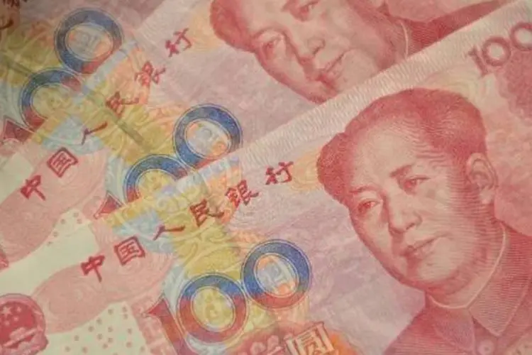 
	Yuan: medida pode autorizar corretoras, seguradoras, fundos e corretores de moeda a entrar no mercado
 (AFP)