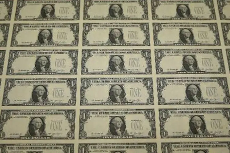 
	Notas de d&oacute;lar: moeda &agrave; vista indicou queda de 0,43%, aos R$ 3,7595
 (Mark Wilson/AFP)