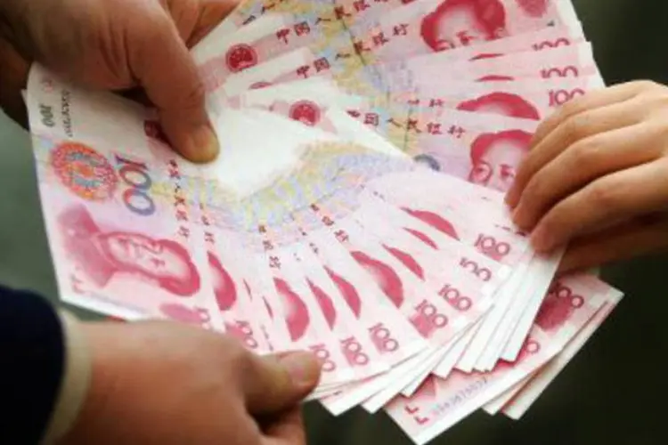 
	Notas de iuanes: companhia busca aproveitar ac&uacute;mulo maci&ccedil;o de dep&oacute;sitos em iuanes em bancos locais
 (AFP)