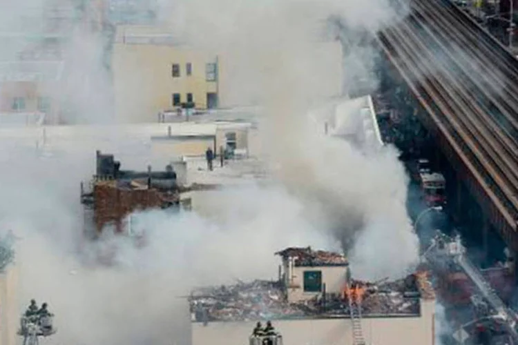 
	Regi&atilde;o onde edif&iacute;cios desabaram ap&oacute;s explos&atilde;o por vazamento de g&aacute;s em Nova York: ainda h&aacute; um n&uacute;mero indeterminado de pessoas desaparecidas
 (Emmanuel Dunand/AFP)