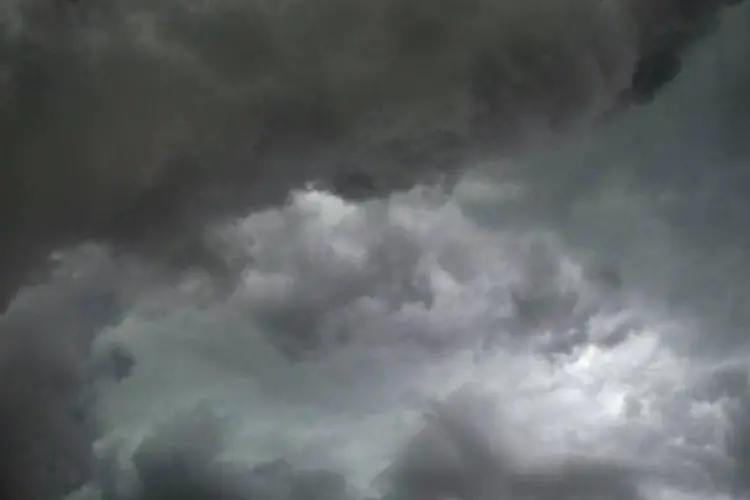 
	Nuvens de chuva prenunciam tempestade: segundo o Centro de Gerenciamento de Emerg&ecirc;ncias (CGE), a Lapa &eacute; o bairro mais atingido
 (AFP / Don Emmert)