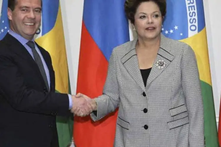 
	O primeiro-ministro russo, Dmitri Medvedev, com Dilma Rousseff: &quot;O Brasil se transformou em um dos mais importantes fornecedores de produtos agropecu&aacute;rios para o mercado russo&quot;
 (REUTERS/Yekaterina Shtukina/RIA Novosti/Pool)