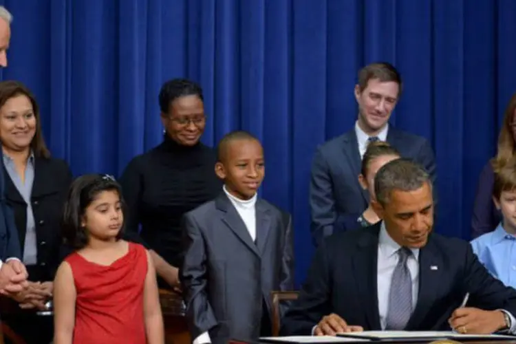 Presidente dos estados Unidos, Barack Obama, assina plano para diminuir violência com armas (©afp.com / Mandel Ngan)