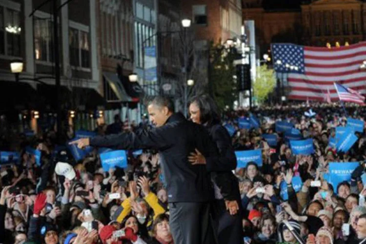 
	Barack Obama e a primeira-dama Michelle Obama durante ato de campanha em Iowa
 (Jewel Samad/AFP)