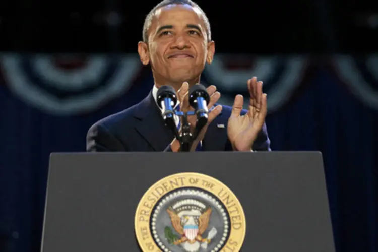 
	O presidente americano, Barack Obama, comemora vit&oacute;ria nas urnas
 (Jason Reed/AFP)