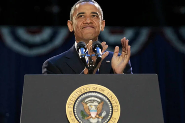 
	O presidente americano, Barack Obama, comemora vit&oacute;ria nas urnas: analistas alertam que este abrupto ajuste fiscal poderia devolver os EUA &agrave; recess&atilde;o no momento mais inoportuno
 (Jason Reed/AFP)