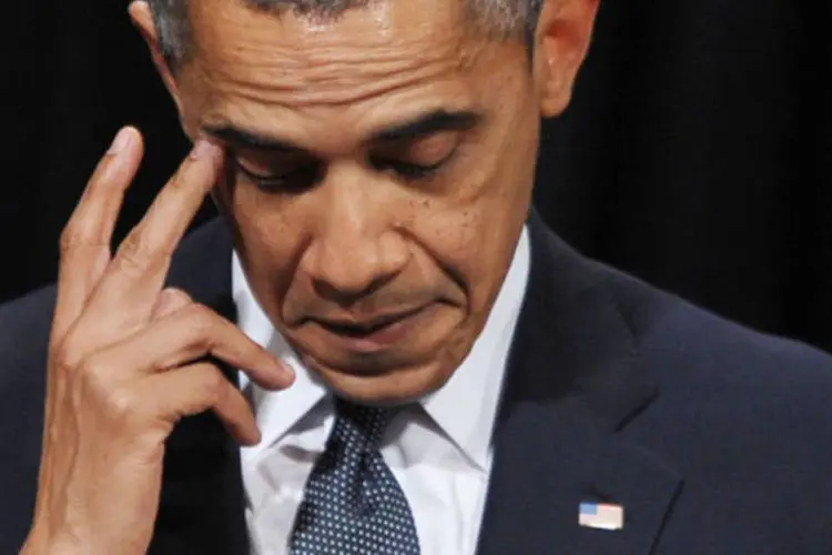 Barack Obama, em visita a Newtown: contudo, o presidente dos EUA não falou os detalhes e nem sequer pronunciou a palavra armas em sua intervenção (©afp.com / Mandel Ngan)