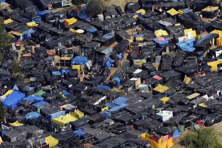 
	Copa do Povo: terreno foi ocupado por moradores durante 4 meses, entre maio e fim de agosto
 (Paulo Whitaker/Reuters)
