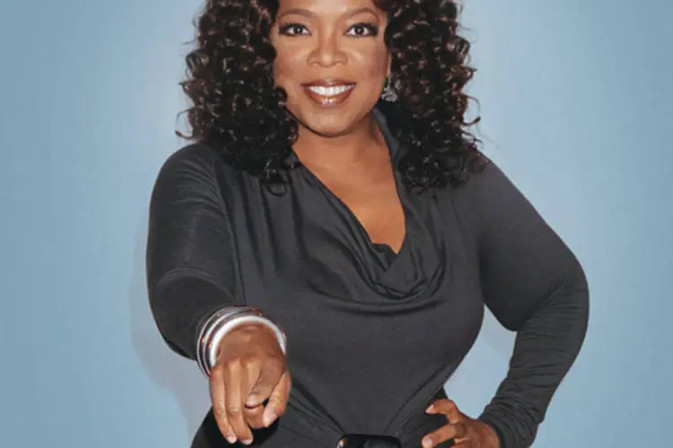 A apresentadora Oprah Winfrey: ela deve aparecer menos na nova emissora (Katy Winn/Getty Images)