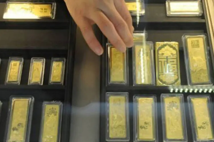 
	Contrato do ouro com entrega para fevereiro havia recuado 1,23% ao fim das negocia&ccedil;&otilde;es desta quinta-feira
 (AFP)