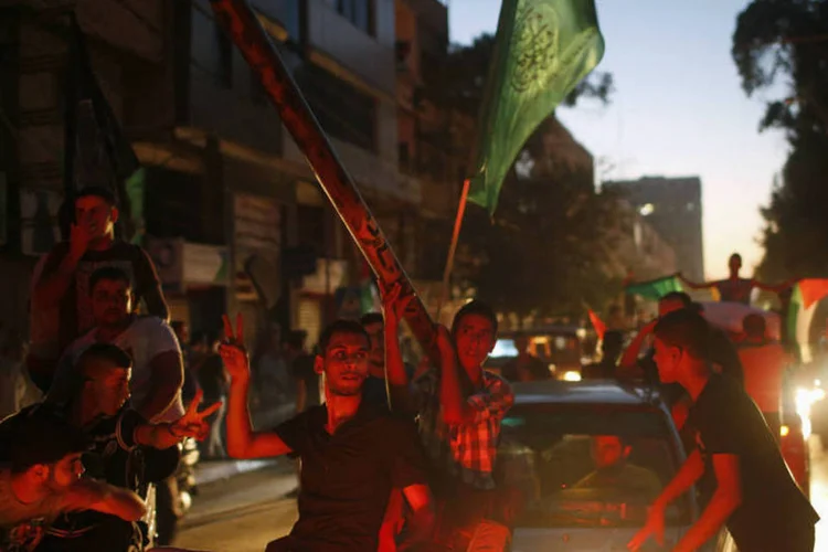 Palestinos comemoram cessar-fogo: em depoimento, o Hamas declarou vitória (Mohammed Salem/Reuters)