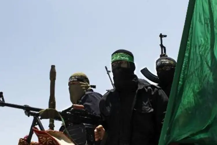 
	Militantes palestinos de grupo armado ligado ao Hamas em funeral de um colega, na Faixa de Gaza
 (Said Khatib/AFP)