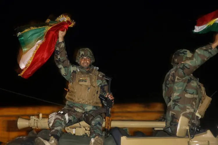 
	Curdos: for&ccedil;as capturaram cintur&atilde;o de pequenas cidades e vilarejos ao redor da cidade, dizem oficiais
 (Yannis Behrakis/Reuters)