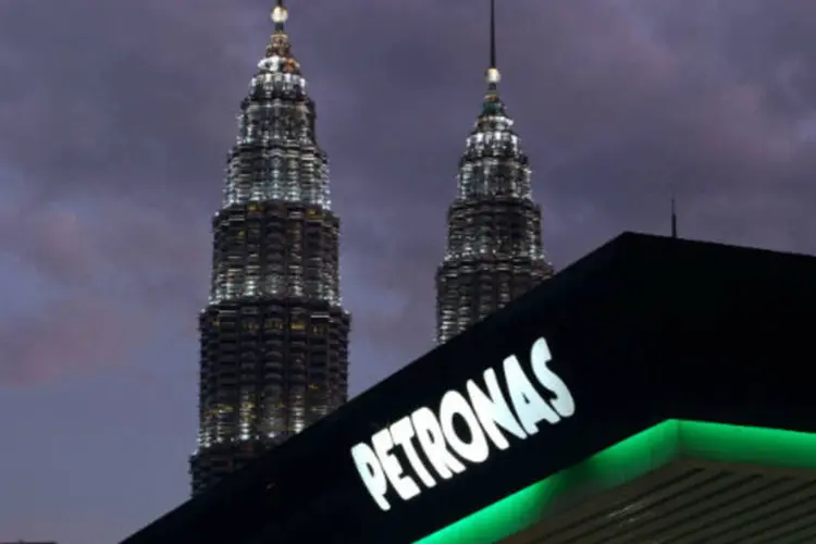 
	Petronas: sem a transfer&ecirc;ncia dos US$ 250 milh&otilde;es, &eacute; pouco prov&aacute;vel que a OGX consiga honrar compromisso com credores
 (Goh Seng Chong/Bloomberg)