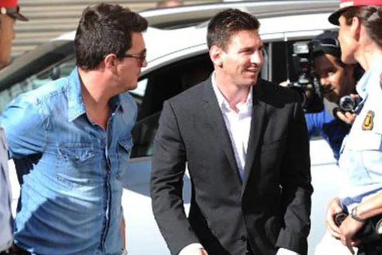 O jogador do Barcelona Lionel Messi chega a tribunal: acusação que não parece ter prejudicado a imagem do astro do futebol (Lluis Gene/AFP)
