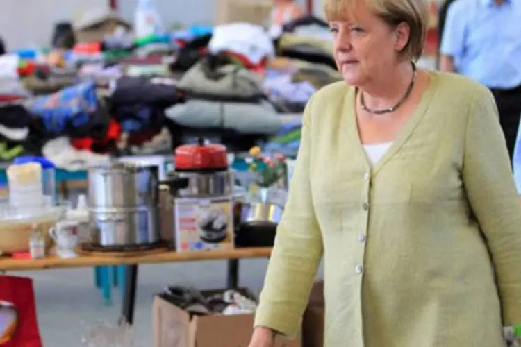 A chanceler alemã, Angela Merkel: cerca de 41 mil pessoas foram assassinadas, morreram de fome ou por causa de doenças neste campo de concentração (Jens Wolf/AFP)