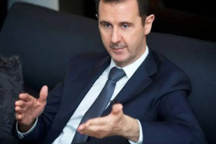 
	Bashar al-Assad:&nbsp;col&eacute;gios eleitorais abriram apenas nas zonas controladas pelo regime
 (AFP)