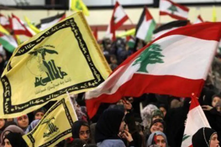
	Simpatizantes do Hezbollah: grupo aderiu abertamente aos conflitos na S&iacute;ria no ano passado
 (Anwar Amro/AFP)