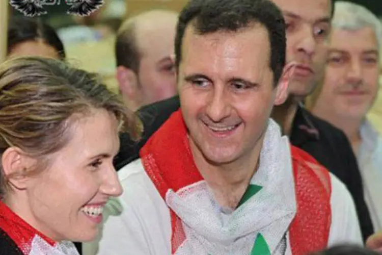 Bashar al-Assad e sua esposa: site pró-regime pediu aos moradores de Damasco que demonstrem apoio ao chefe Estado (AFP)