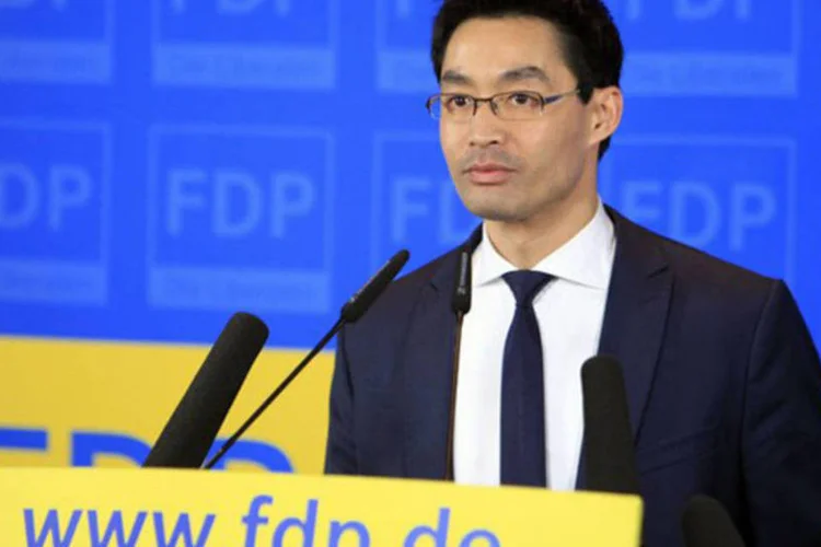 Ministro da Economia e líder do FDP Philipp Roesler chega ao QG do partido em Berlim, 20 de janeiro de 2013
 (Frederic Lafargue/AFP)