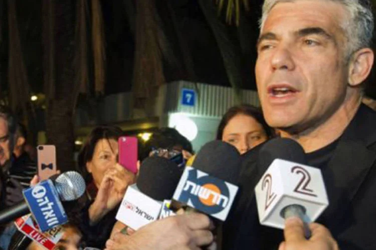
	Yair Lapid: n&atilde;o disse como prev&ecirc; a desmilitariza&ccedil;&atilde;o do Hamas, que prometeu nunca desistir de suas armas
 (Jack Guez/AFP)
