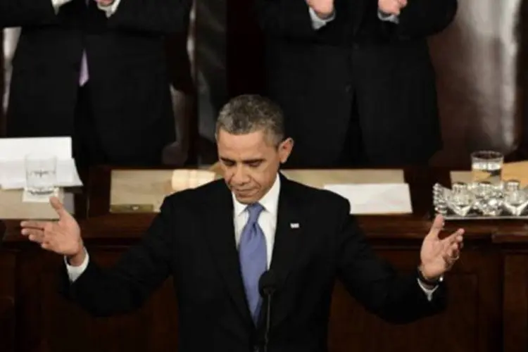 
	Obama discursa no Congresso: o presidente fez o discurso diante de congressistas e funcion&aacute;rios do governo, assim como de v&iacute;timas da viol&ecirc;ncia armada e parentes
 (Paul J. Richards/AFP)