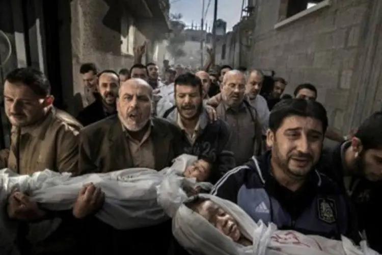 
	Foto de Paul Hansen mostrando duas crian&ccedil;as palestinas mortas em ataques israelenses em Gaza: &quot;&eacute; uma foto que nunca esquecerei&quot;, disse membro do j&uacute;ri
 (Paul Hansen/AFP)