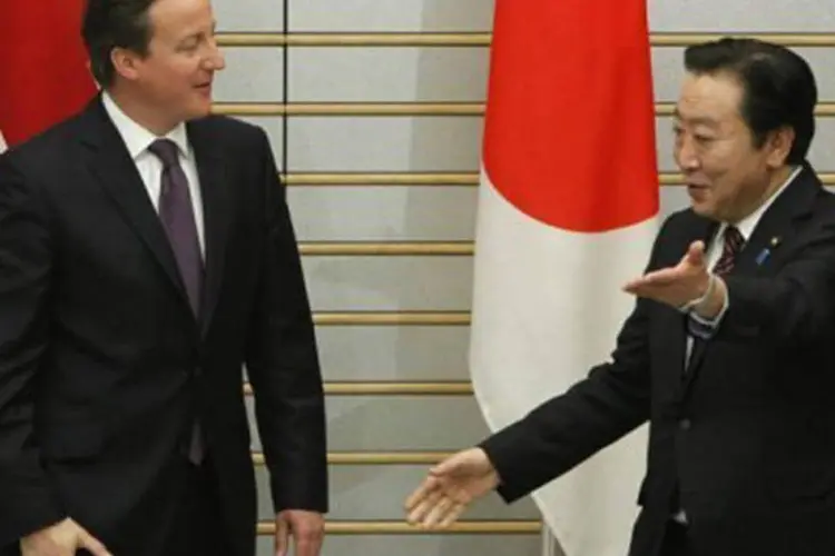 
	Yoshihiko Noda recebe David Cameron na resid&ecirc;ncia oficial do primeiro-ministro: Noda era visto como um pragm&aacute;tico que trabalhava em boa sintonia com os l&iacute;deres estrangeiros
 (Toru Hanai/AFP)
