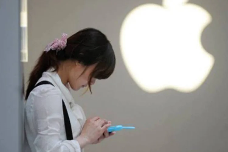 
	Cliente em uma loja da Apple:&nbsp;o Departamento de Justi&ccedil;a argumentou que a Apple e as editoras combinaram de aumentar os pre&ccedil;os por meio de uma ag&ecirc;ncia de precifica&ccedil;&atilde;o.
 (Peter Parks/AFP)