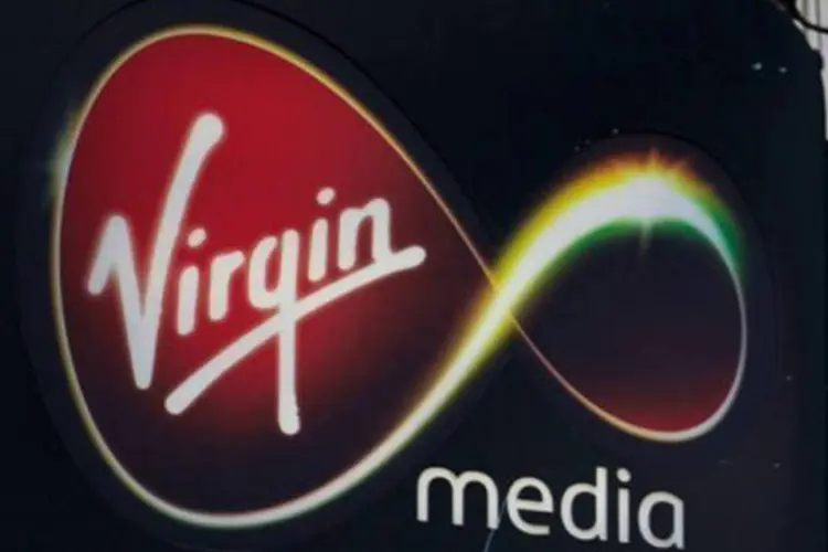 
	Propaganda da Virgin Media na Oxford Street, em Londres: os dois grupos compram conte&uacute;dos audiovisuais e redes de televis&atilde;o
 (Andrew Cowie/AFP)