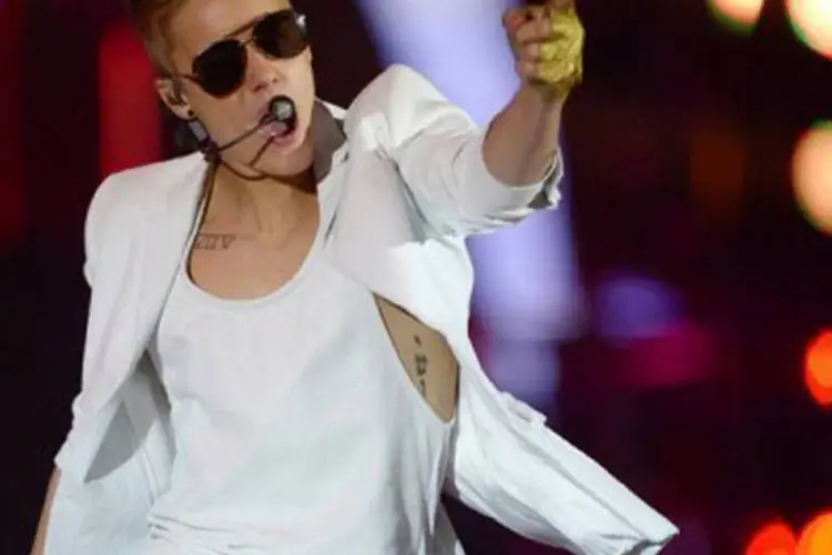 
	O cantor canadense Justin Bieber: de acordo com as leis australianas, esse tipo de infra&ccedil;&atilde;o tem como puni&ccedil;&atilde;o entre 80 e 100 horas de trabalhos comunit&aacute;rios
 (Rainer Jensen/AFP)