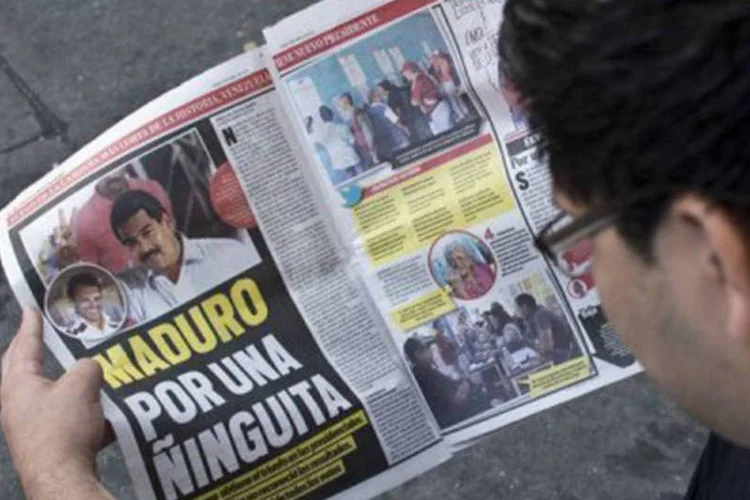 
	Jornal anuncia a vit&oacute;ria de Maduro por uma diferen&ccedil;a apertada: opositores exigem a recontagem dos votos
 (Ronaldo Schemidt/AFP)