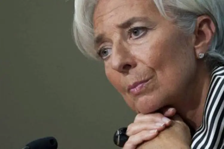
	Christine Lagarde: bolsas atingiram m&iacute;nimas da sess&atilde;o quando diretora do Fundo Monet&aacute;rio Internacional alertou contra complac&ecirc;ncia e tamb&eacute;m o triunfalismo europeu
 (Saul Loeb/AFP)