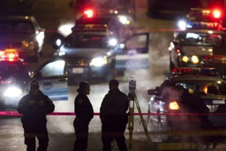 
	Policiais no local de um tiroteio, em Seattle, em 2009: a pol&iacute;cia est&aacute; buscando testemunhas
 (Stephen Brashear/AFP)