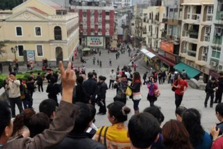 
	Turistas chineses em Macau: cerca de 83 milh&otilde;es de chineses sa&iacute;ram do pa&iacute;s de f&eacute;rias no ano passado
 (Laurent Fievet/AFP)